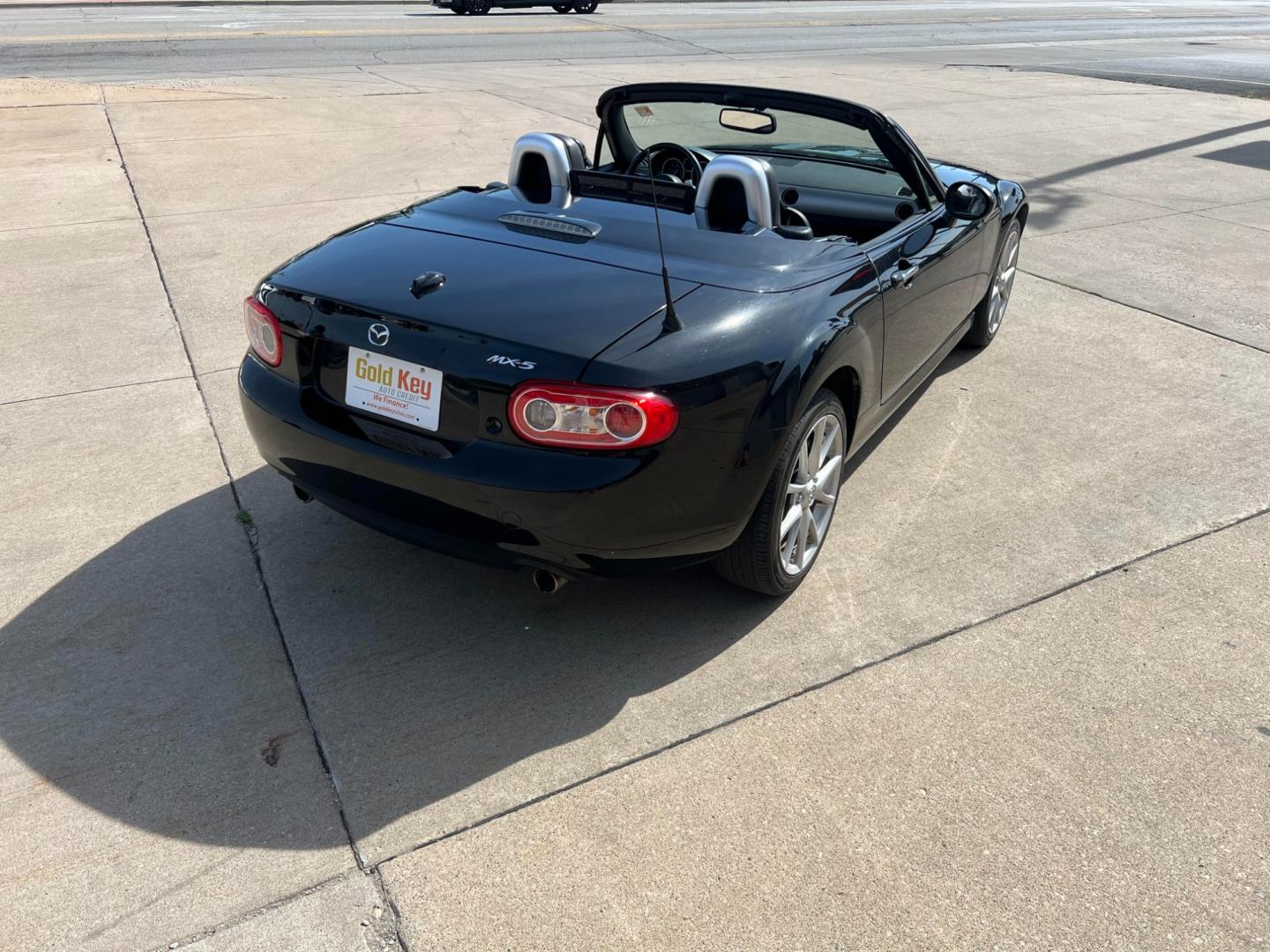 2012 Brilliant Black with Brilliant Black Hard Top /Black Leather Interior Mazda MX-5 Miata Grand Touring PRHT (JM1NC2PF6C0) with an 2.0L L4 DOHC 16V engine, 6-Speed Automatic transmission, located at 104 1st Avenue, Silvis, IL, 61282, (309) 755-9511, 41.515156, -90.425377 - Photo#2